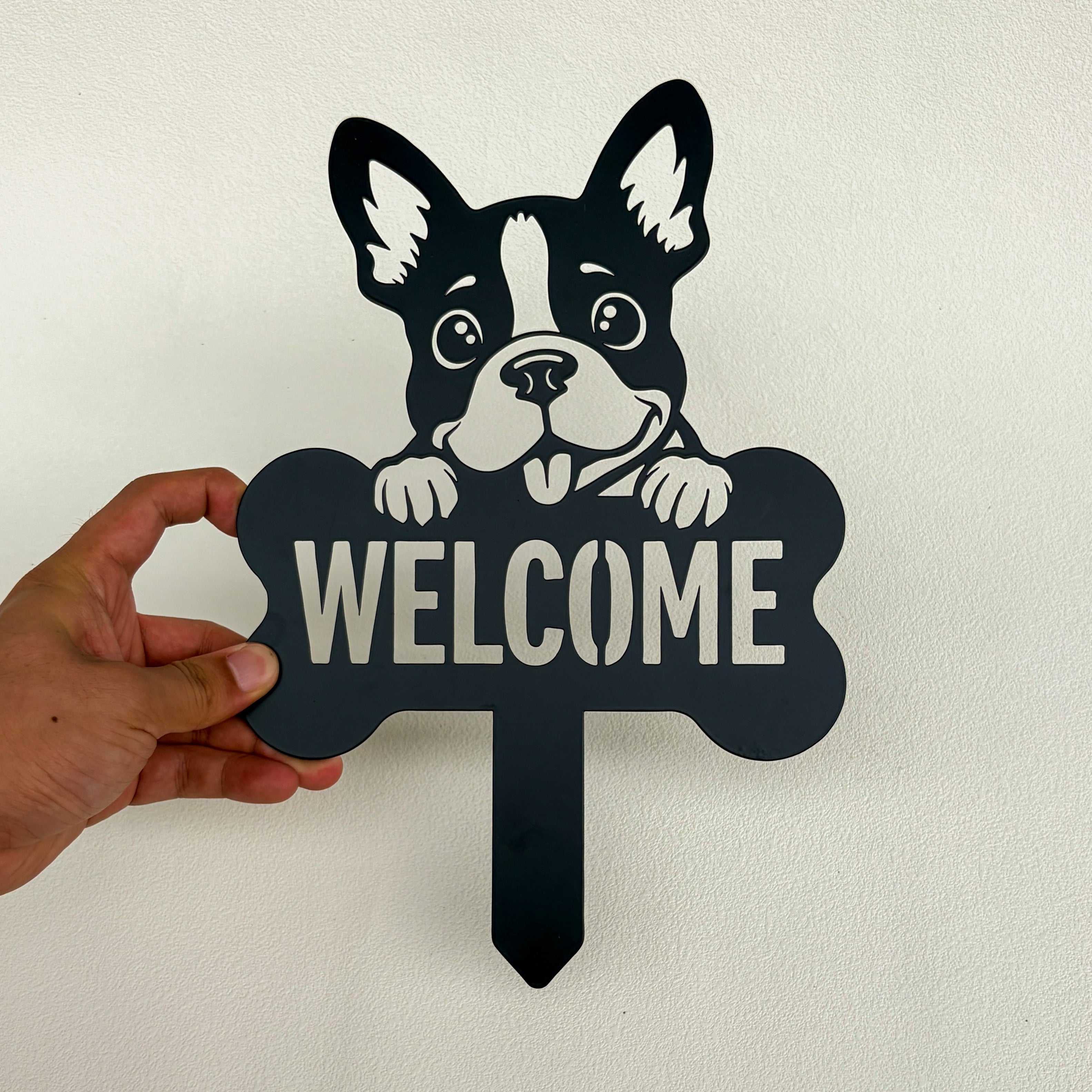 Finished black metal dog welcome garden stake after powder coating