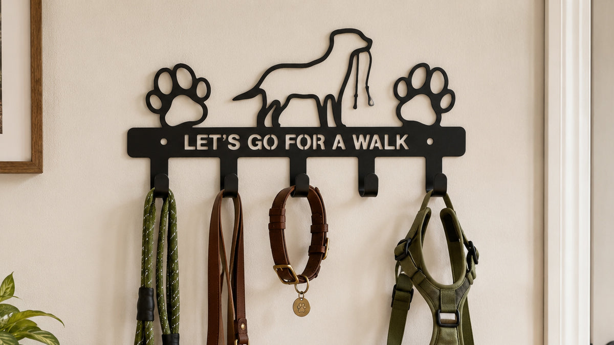 Black metal dog leash holder wall hook with leashes, collar, and harness