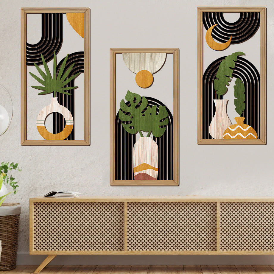 Set of three framed UV-printed botanical wall decorations with leaves and vases