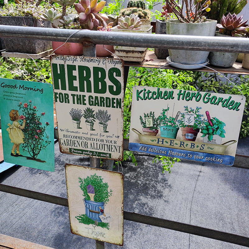 Collection of vintage-style UV-printed metal herb garden signs displayed outdoors